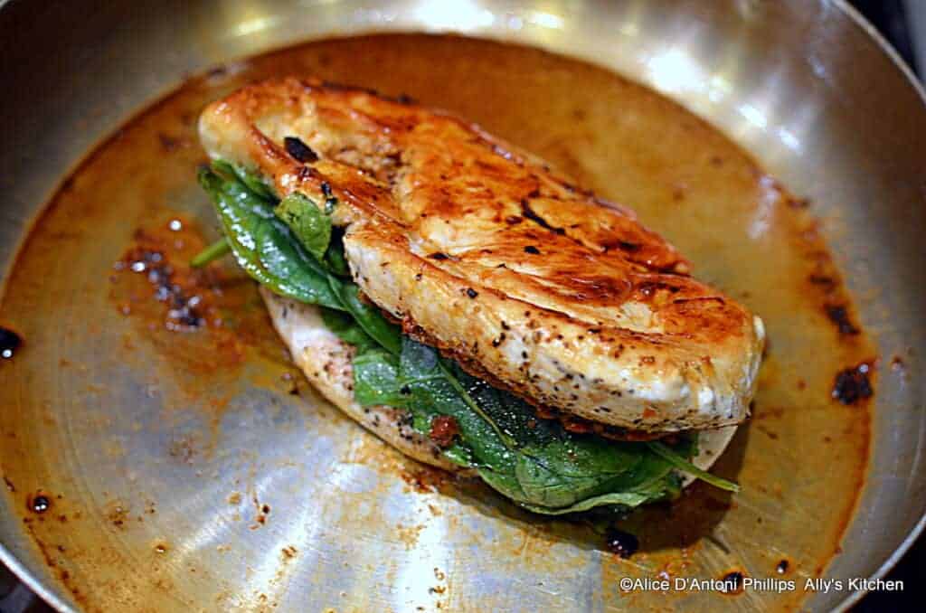 ~tomato pesto spinach stuffed grilled chicken with chunky sauce & crumbled lemon herb feta~