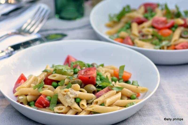 bowl of spaghetti with vegetables in a skillet