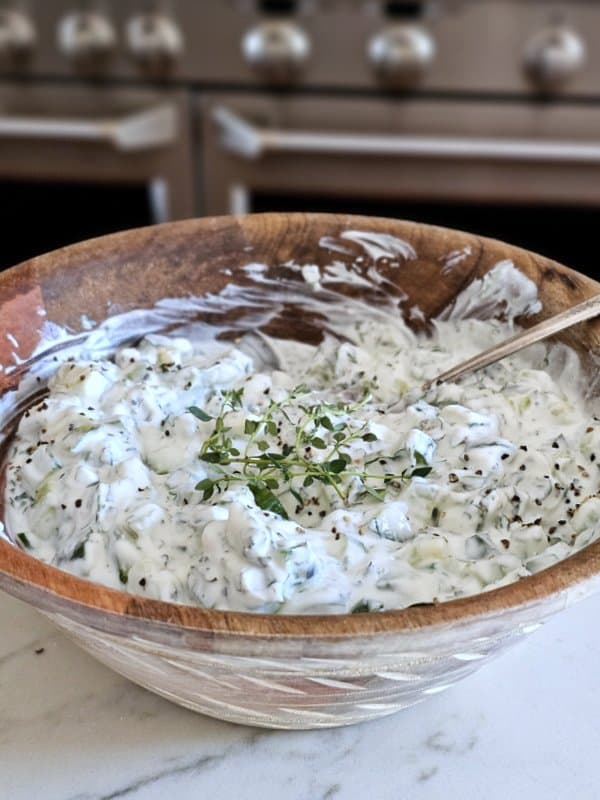 Closeup shot of bowlful of easy yogurt cucumber dip